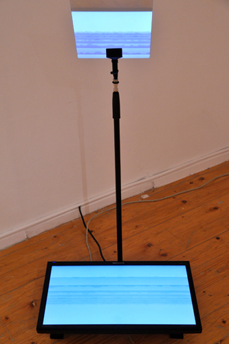 Samsung flatscreen, modified microphone stand, clamp and reflective titanium glass